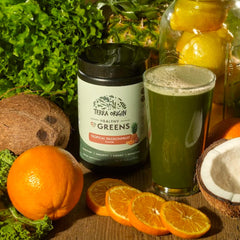 Lifestyle shot of a healthy person enjoying a greens powder smoothie