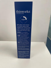 Cozy bedroom scene showing pillow spray on linens at night