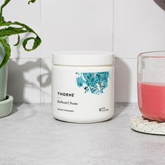 Thorne Buffered C Powder with measuring spoon in use