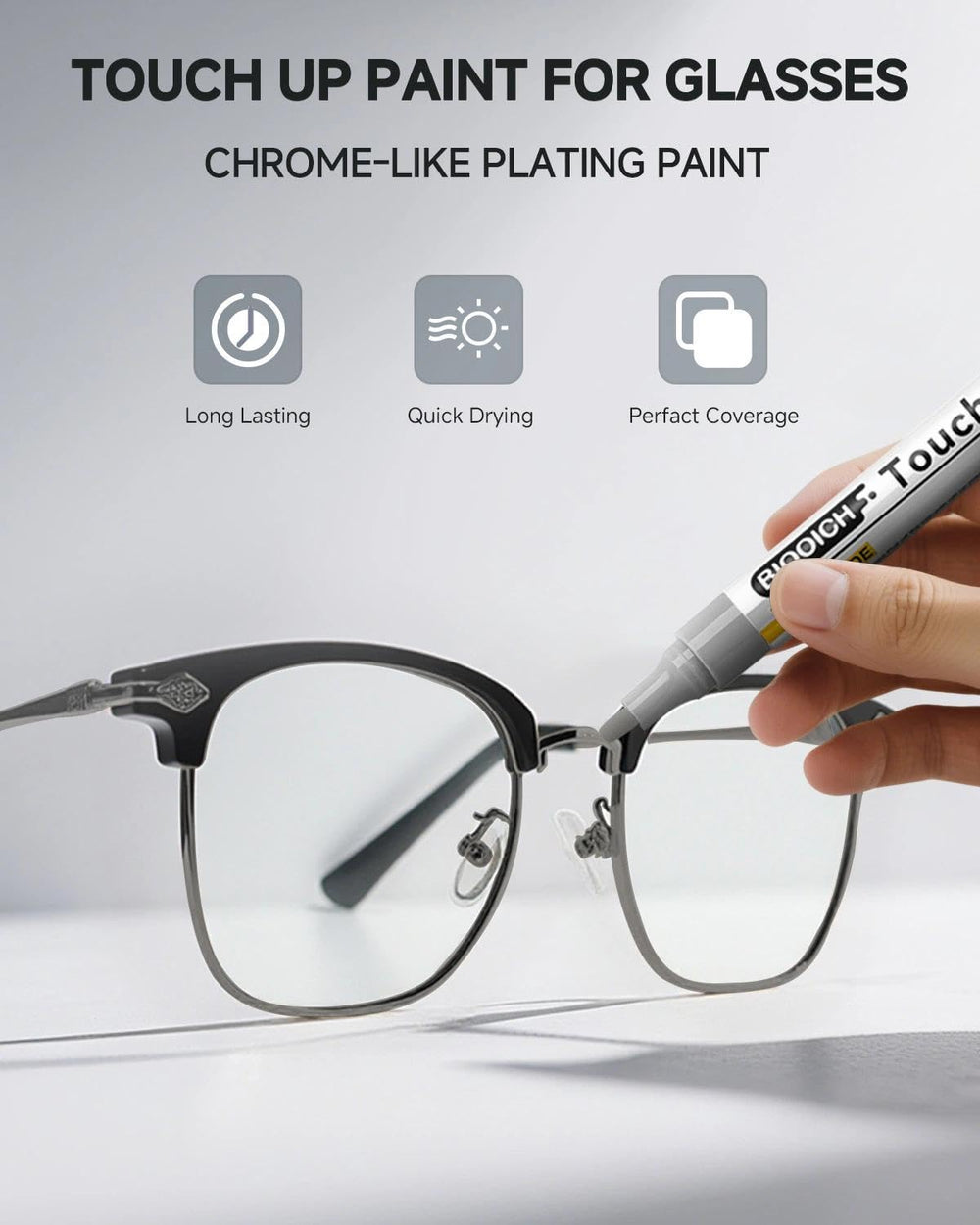 Repair pen applying paint to scratched eyeglass frame
