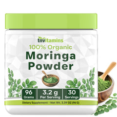 Organic moringa powder in a scoop
