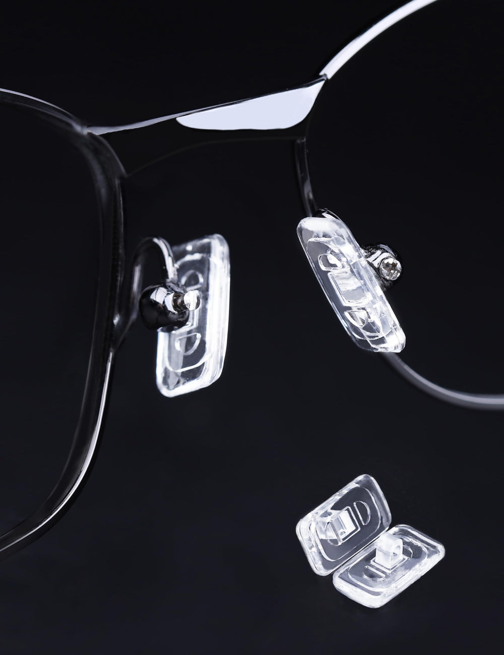 Close-up of screws and micro screwdriver included with Tolaxy nose pads