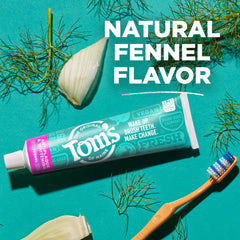 Toothpaste tube standing upright with cap on