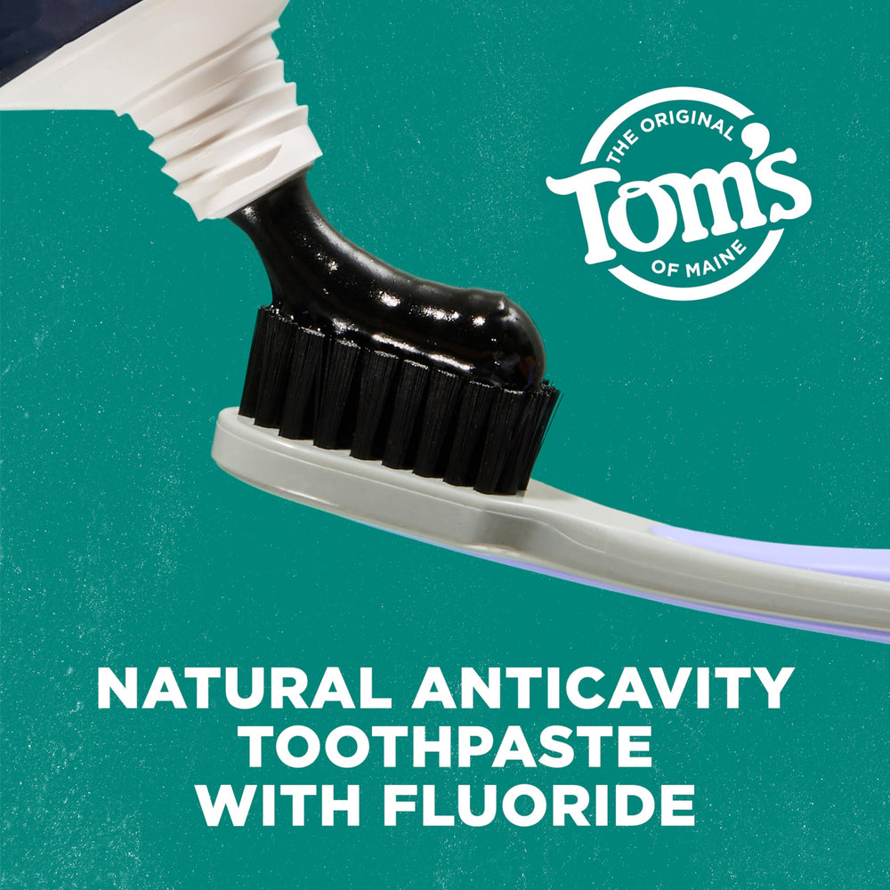 Close-up of Tom's of Maine charcoal toothpaste tubes showing 4 oz size