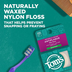 Flat waxed antiplaque floss strands close-up