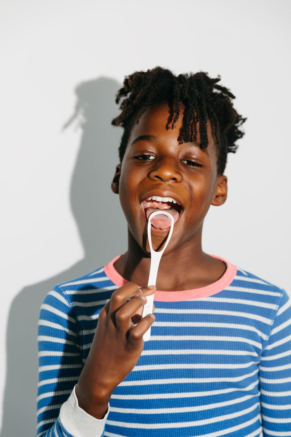 Tongue Luv tongue scraper on white background