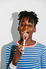 Tongue Luv tongue scraper on white background