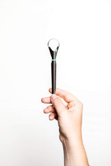 Close-up of the stainless steel tongue cleaner head