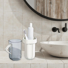 Travel case storing toothbrush, toothpaste, and small essentials