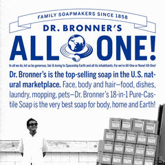 Person brushing teeth with Dr. Bronner's All-One Toothpaste Peppermint