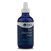 Trace Minerals Keto Electrolyte Drops bottle on a workout setup for quick hydration.