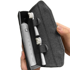 Compact black electric toothbrush travel case with main compartment