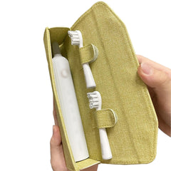 Close-up of magnetic clasp on green toothbrush travel case