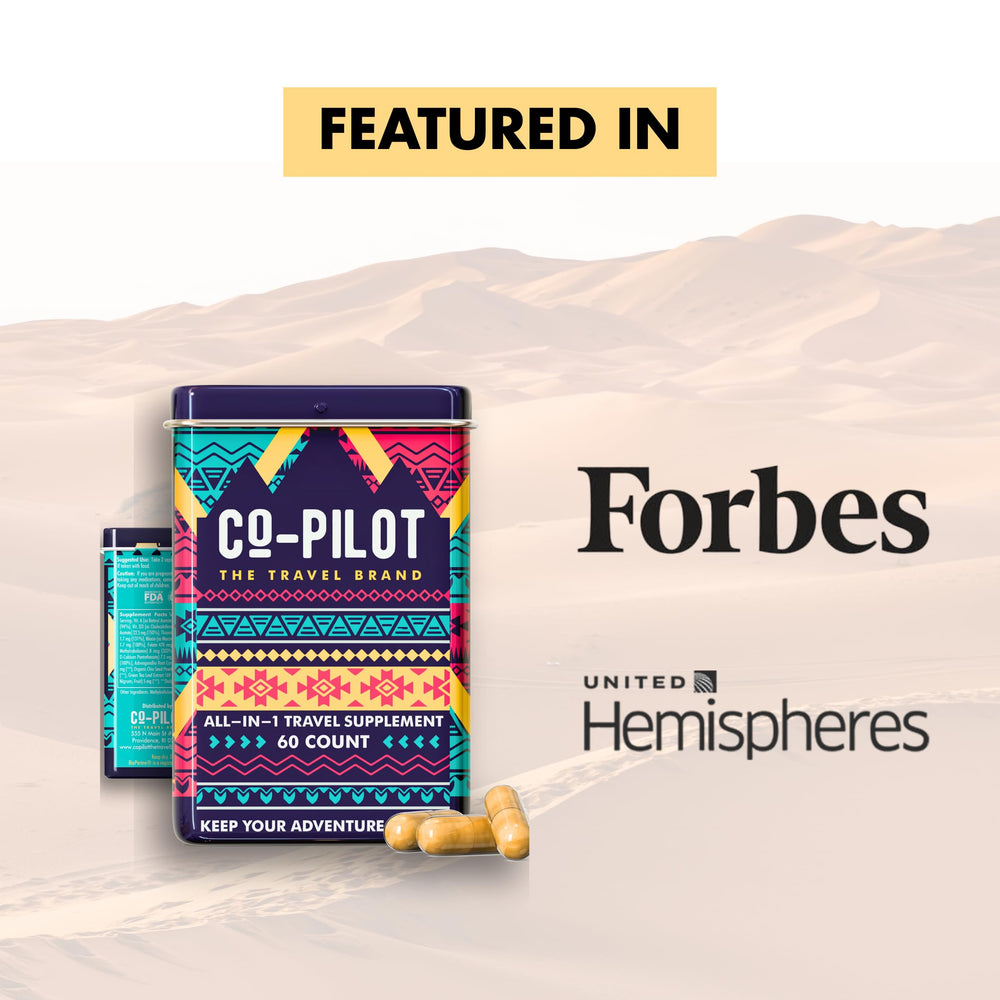 Flat lay of travel vitamin bottle with natural ingredients