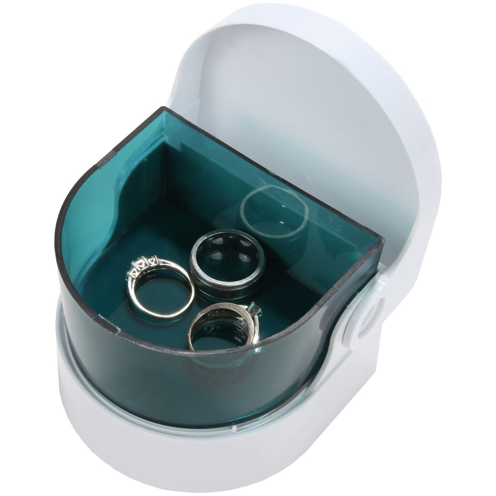 Travel-ready denture cleaner compact in a bag