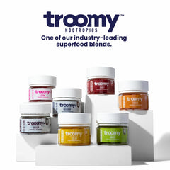 Product scene with gummies spilling from the bottle