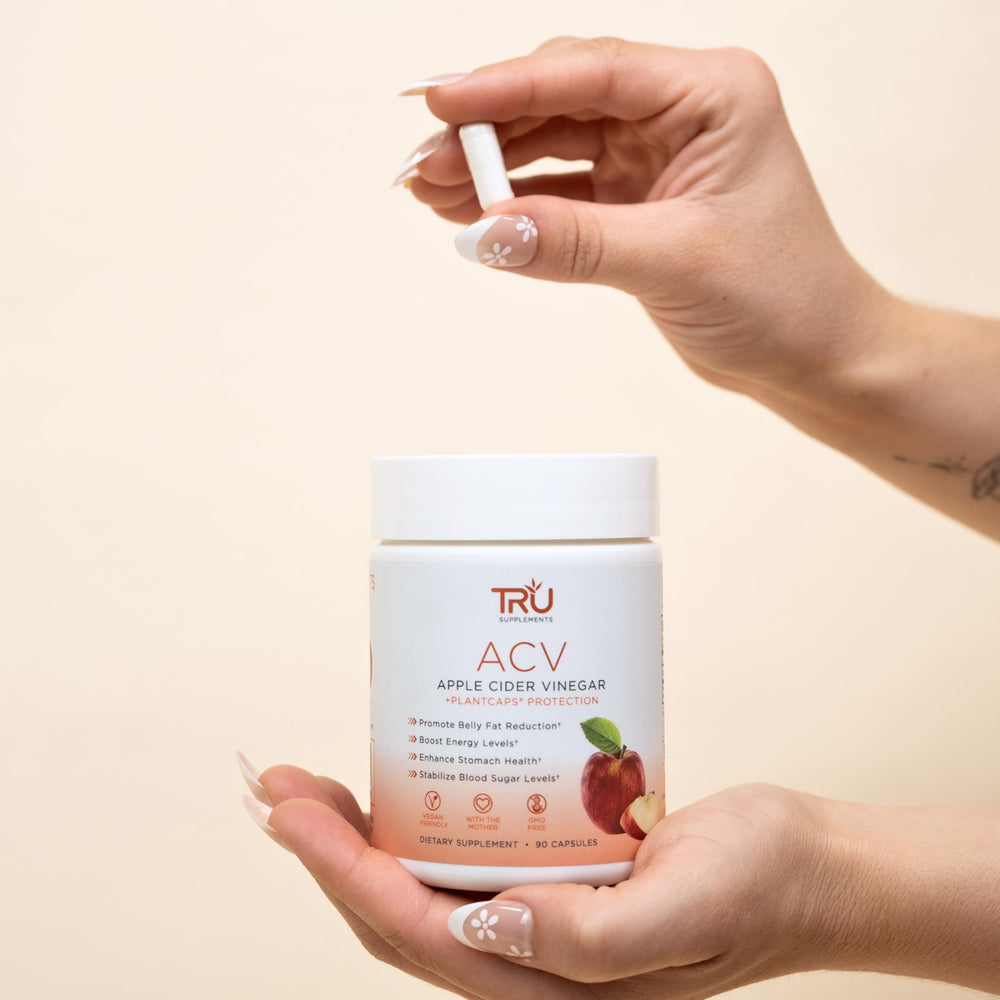 TRU Supplements ACV capsules poured from bottle highlight easy daily dosage.