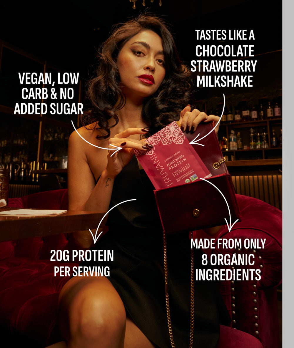 Truvani vegan pea protein powder shake in glass illustrating a tasty chocolate strawberry flavor