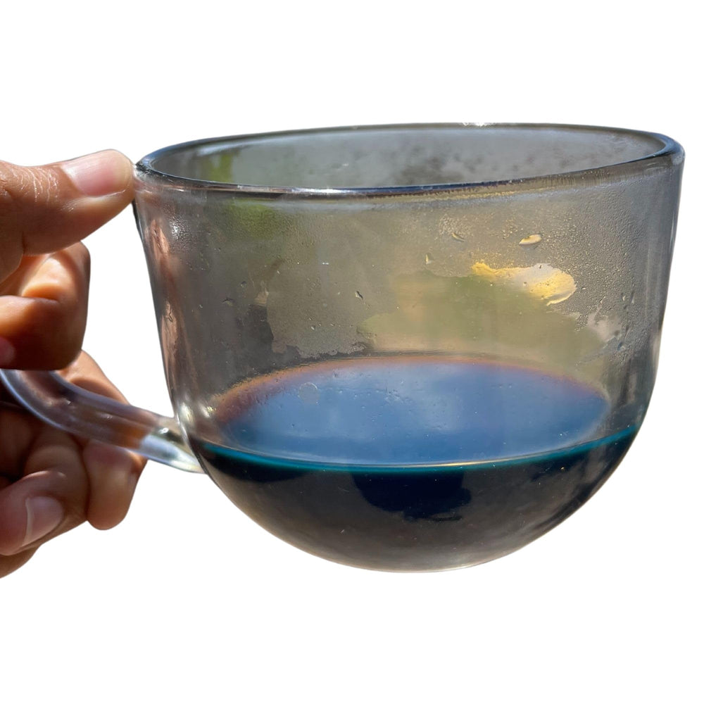 Cup of Palo Azul tea with rich brown-blue hues