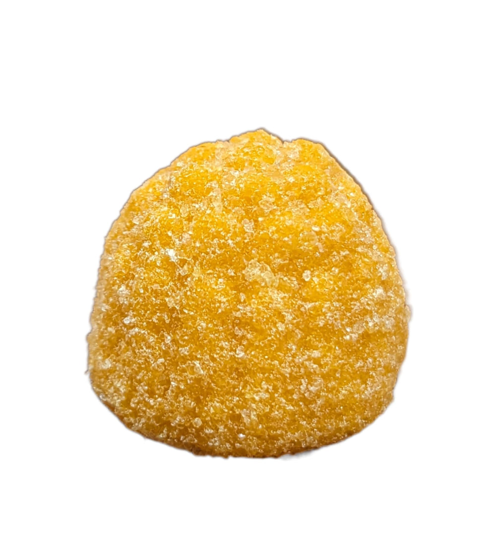 Gummies arranged with peach flavor and supplement ingredients