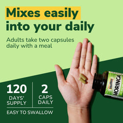 Two capsules serving with a glass of water