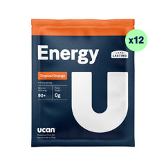 UCAN Energy Powder Tropical Orange in a glass of water, ready to drink.