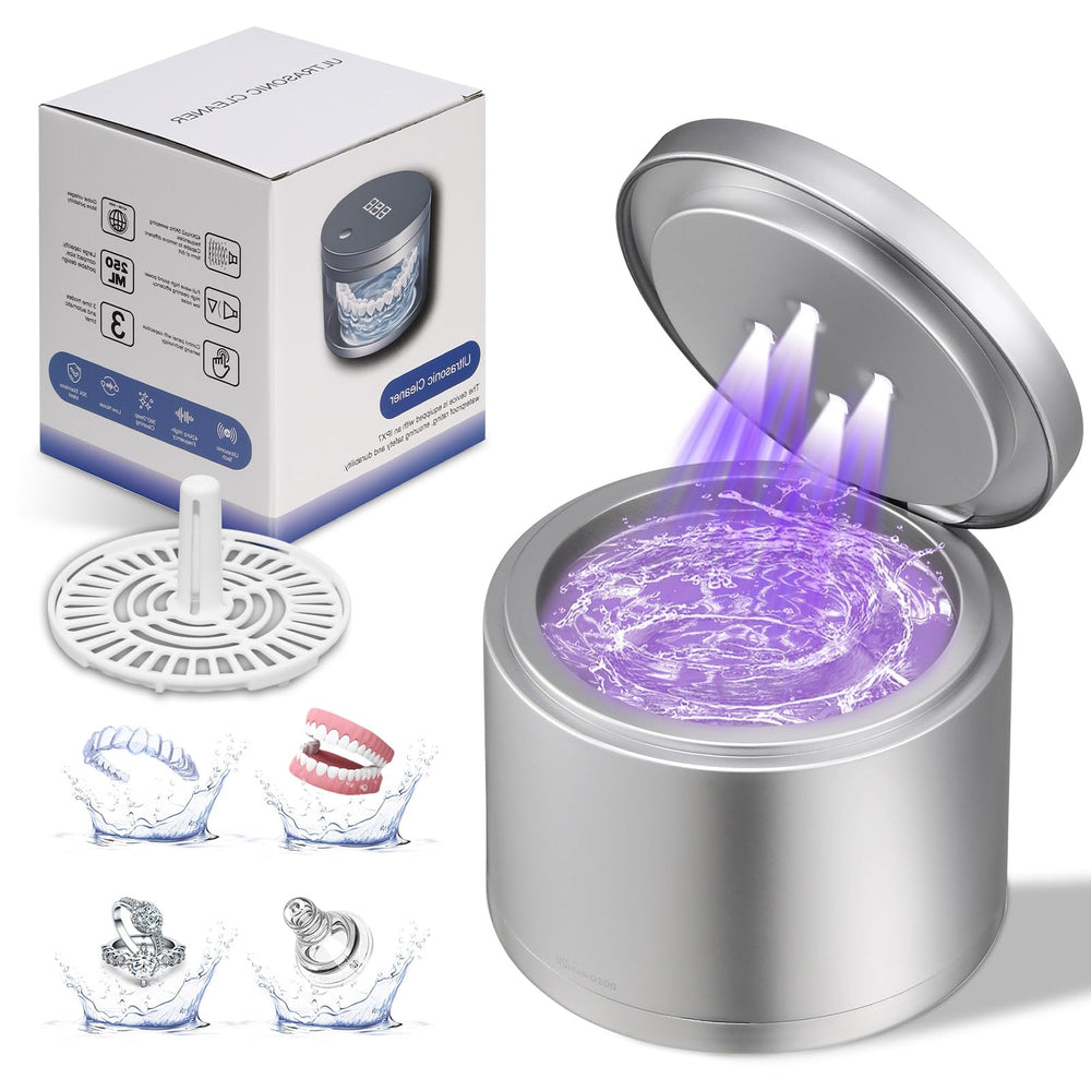 Ultrasonic cleaner unit with mouthguards and jewelry in the tank