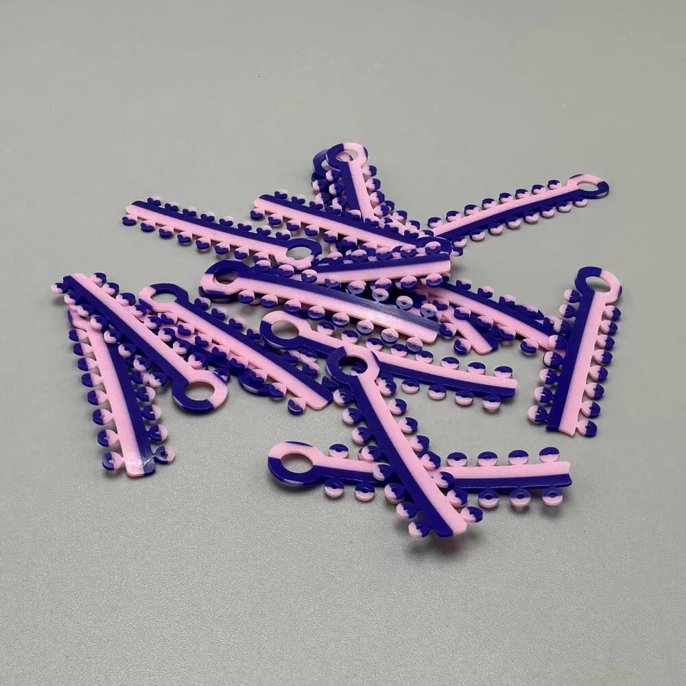Two-color ligature ties arranged to show color versatility for braces