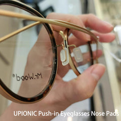 Packaging showing five pairs of clear nose pads