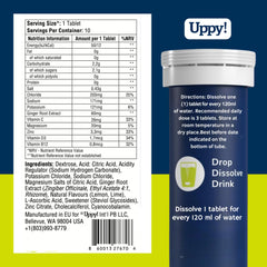 Uppy Lemon-Lime Electrolyte Tablets dissolving in glass for quick hydration during travel.
