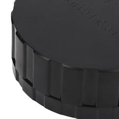 Round black denture storage box on bathroom counter