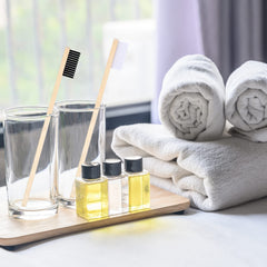 Individually packaged bamboo toothbrushes for travel and hotel use