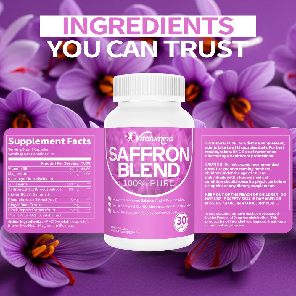 Person working on a laptop with VitaLumina saffron bottle nearby