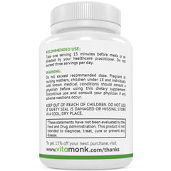 Capsules placed next to a glass of water