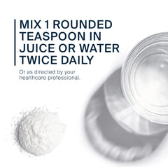 Serving size scoop with powder and glass of water