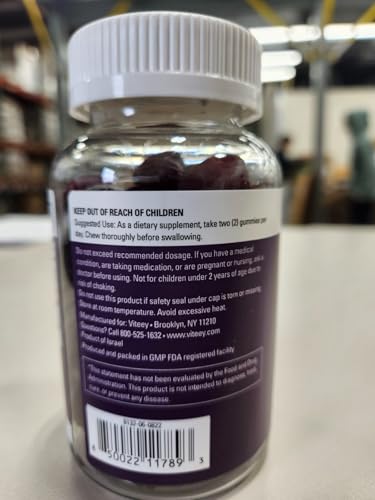 Bottle on white background with gummies visible