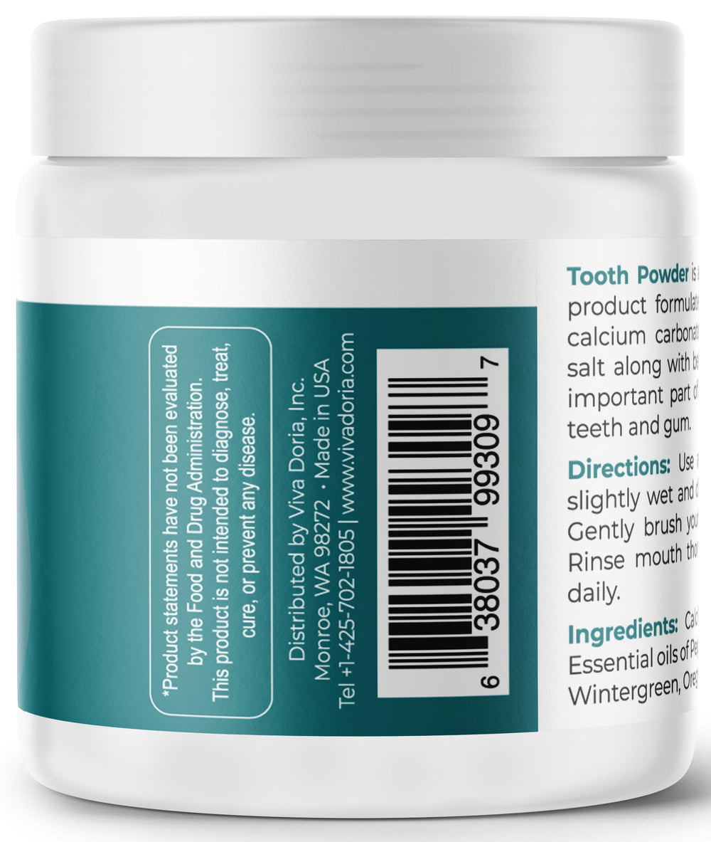 Mint-flavored remineralizing tooth powder being mixed with water to form a paste