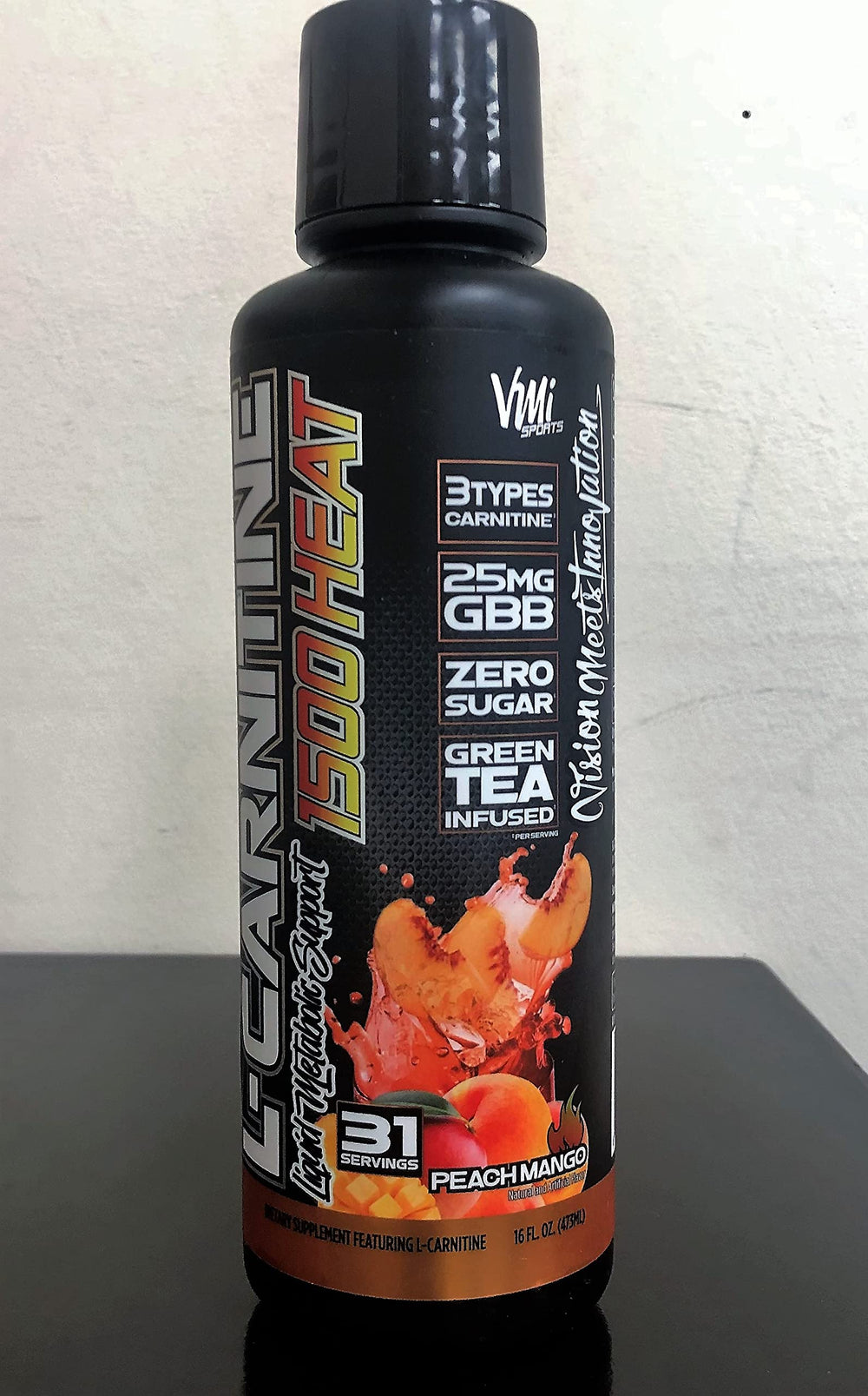 VMI Sports L-Carnitine 1500 Heat shaker ready for a refreshing peach-mango workout session.