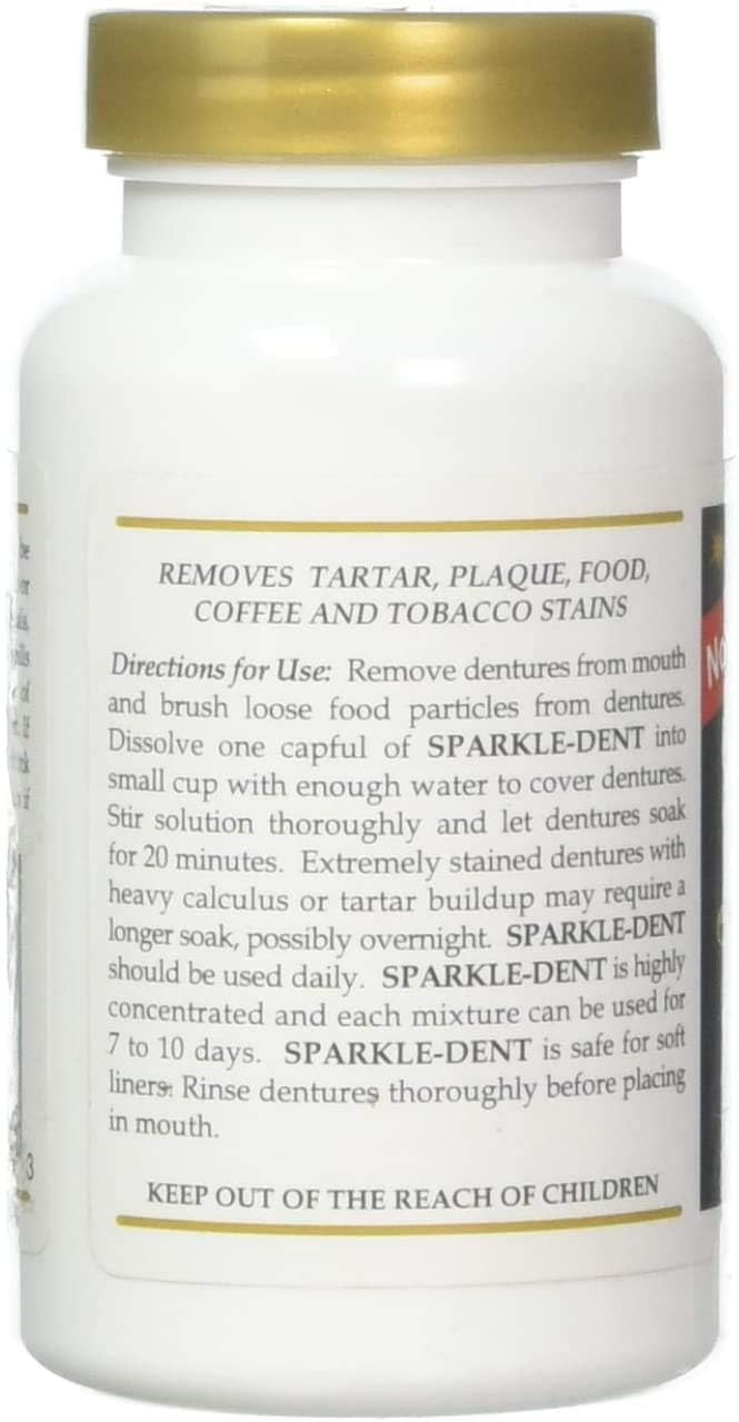 Dentures soaking in Sparkle-Dent solution showing cleaning action
