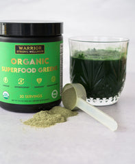 Greens powder scoop with Warrior Strong Wellness organic greens