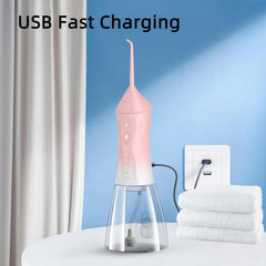 Ergonomic handle of water flosser with nozzle