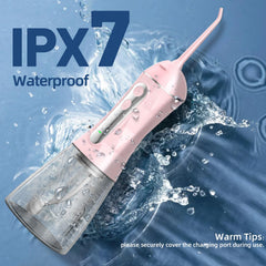 Travel bag included with pink Water Flosser