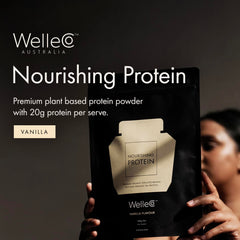 WelleCo vanilla protein powder stirred with plant milk for a smooth shake.