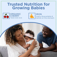 Dropper dispensing iron drops toward a child's inner cheek