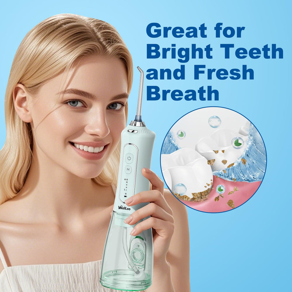 Compact travel-friendly water flosser with included nozzles