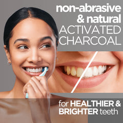 Close-up of black charcoal toothpaste on toothbrush