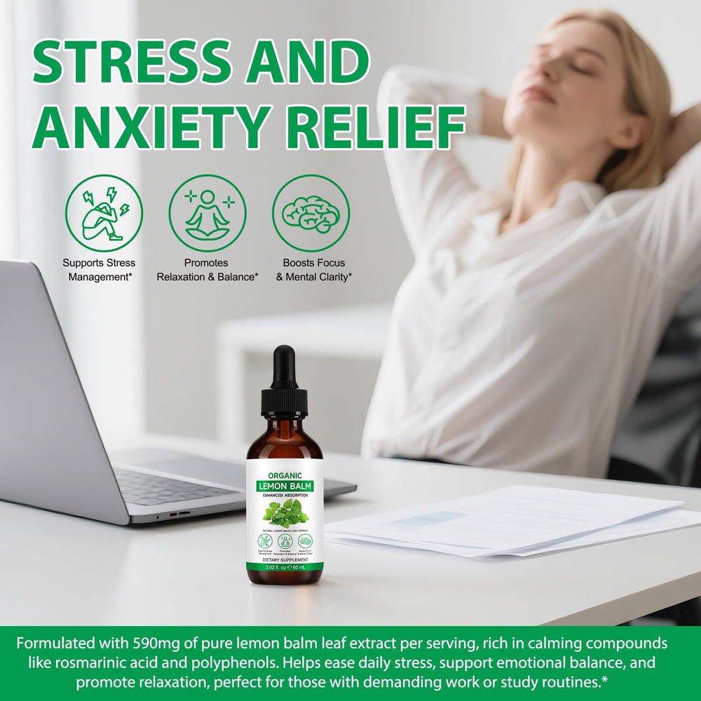 Lemon balm leaves and bottle on wooden surface