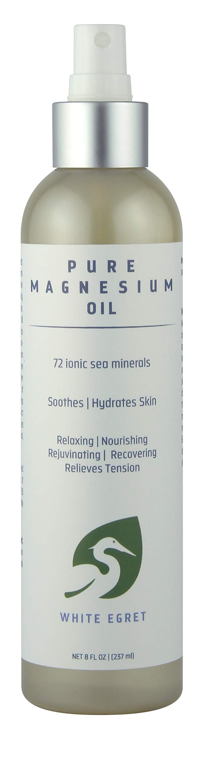 Bottle of White EGRET Magnesium Beauty Oil - 8 FZ with soft floral background