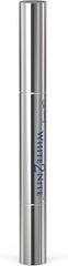 Applying White2nite whitening pen to teeth