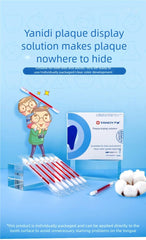 Close-up of plaque disclosing tablets staining teeth in bright red